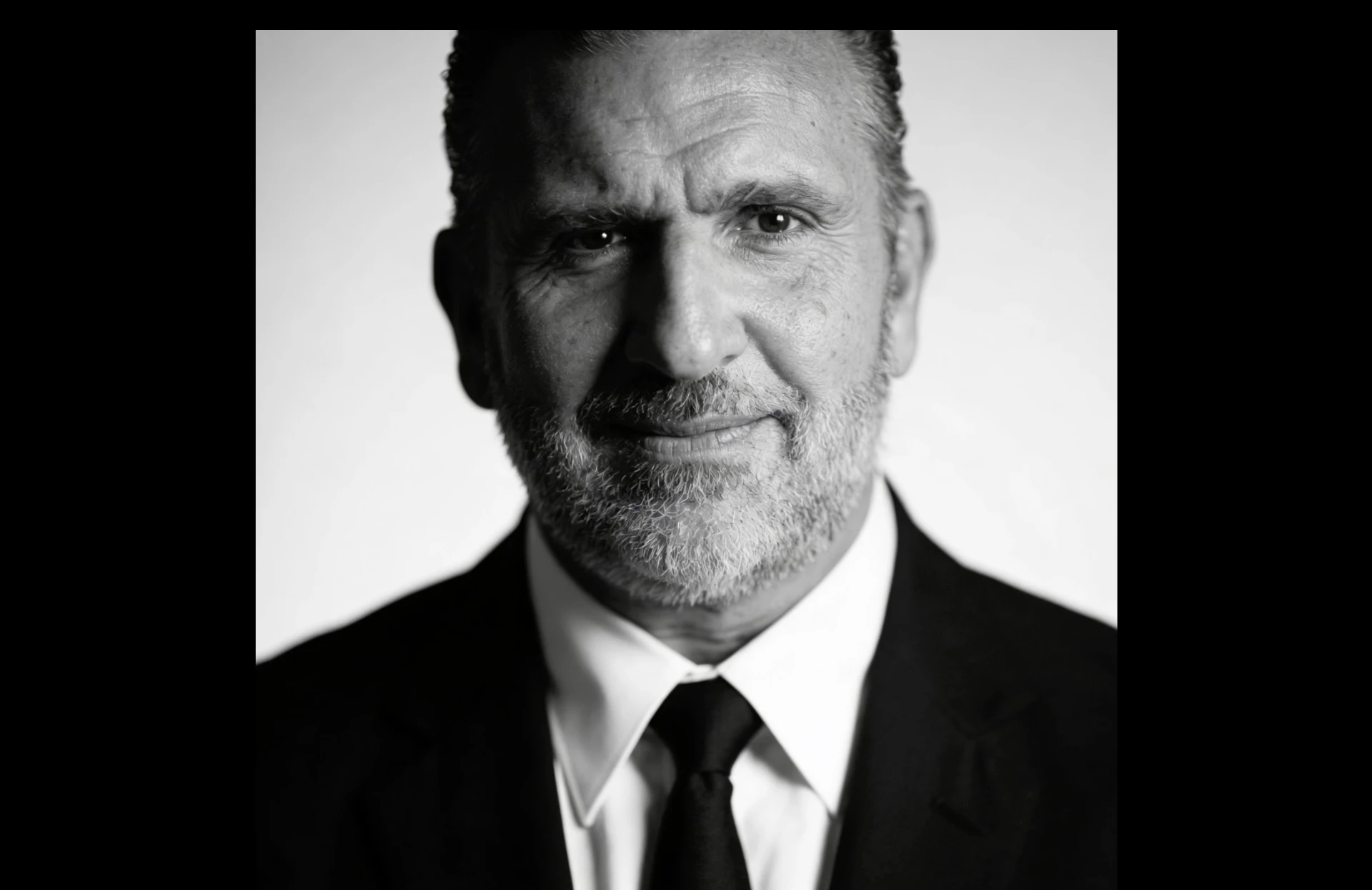 Black-and-white portrait of Roberto Arzú García-Granados in a dark suit and tie